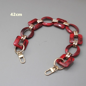 Detail view of 42cm vintage acrylic resin chunky bag chain with red marble links and gold clasps