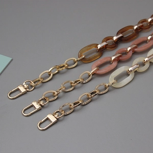 Elegant acrylic bag chain accessory in amber, pink and white with gold lobster clasps