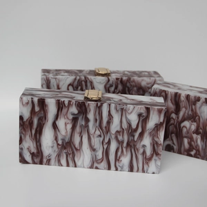 Elegant rectangular evening clutch bag with red marble texture and gold clasp