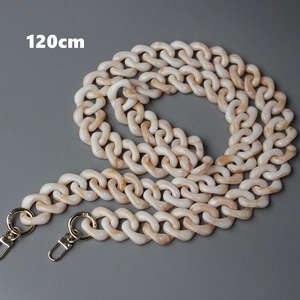 Detailed view of 120cm amber resin handbag chain with gold metal lobster clasps