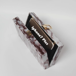 Detail view of burgundy marble clutch bag interior with room for iPhone 7 Plus