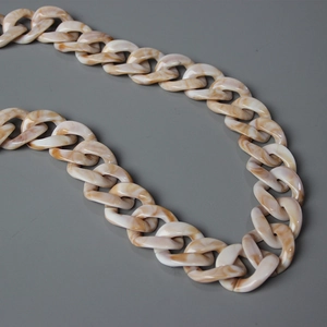 Close-up of thick marble texture acrylic resin chain links for bags or necklaces