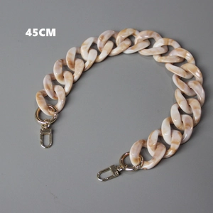 Detail view of 45cm cream marble acrylic bag chain with gold metal lobster clasps