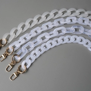 Detailed view of resin acrylic purse chains in marble patterns and matte white finish