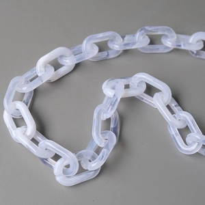 Macro shot of stylish beige marble acrylic chain strap for handbags and accessories