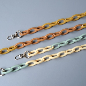 Detail of colorful resin acrylic chain bag straps with silver spring clasps