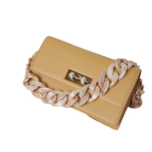 Chic yellow faux leather handbag with retro acrylic resin chain and pearl metal lock