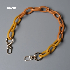 Detail of 46cm orange and yellow resin bag chain with silver metal lobster clasps