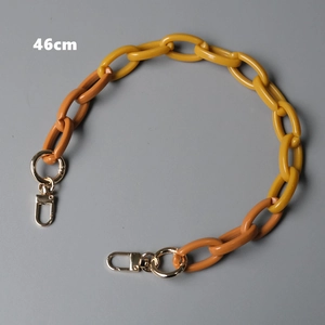 Close-up of 46cm two-tone resin chain strap with yellow and orange links and gold clasps