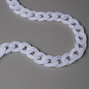 Close-up of translucent white marble resin chain strap with thick rounded links for handbags