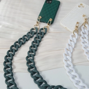 Detail of colorful acrylic resin chain straps in matte green and white for bags and phones