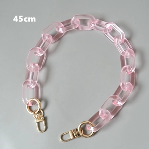 Detail showing 45cm pink acrylic chain link strap with gold metal lobster clasps