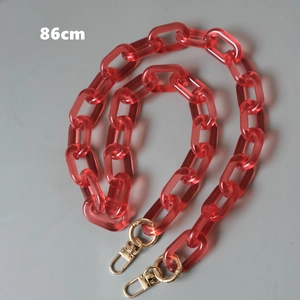 Translucent red acrylic bag chain link with gold metal clasps and 86cm length detail