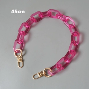 Close-up of 45cm pink acrylic bag chain with chunky oval links and gold lobster clasps