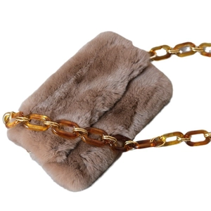 Brown faux fur crossbody bag featuring vintage amber acrylic and gold metal chain strap