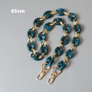 Detail showing 85cm resin bag chain with marble texture and golden metal links