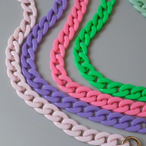 Macro detail of colorful chunky acrylic resin fishbone chains for handbag straps
