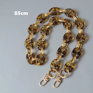 Close-up of 85cm amber resin chain with gold metal rings and lobster clasps