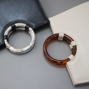 Minimalist tote bags with marble resin round handles in black and cream white colors