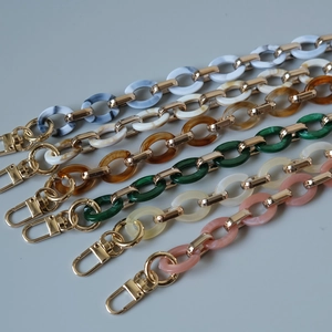 Detail of colorful marble pattern acrylic resin handbag chains with gold metal clasps