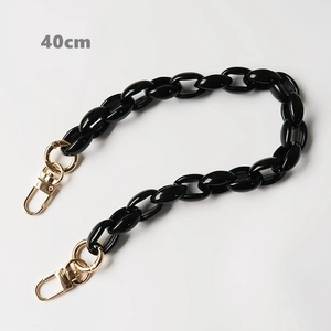 Close-up of 40cm black acrylic chunky chain strap with gold metal lobster clasps