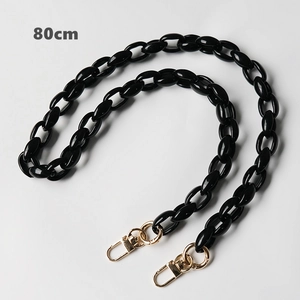 Detail of 80cm black acrylic chunky chain strap with golden metal lobster clasps