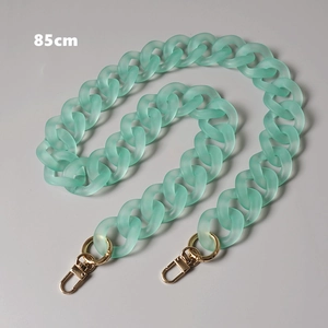 Detail view of 85cm seafoam green acrylic chain with golden lobster clasps for bags