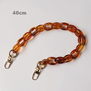 Detail view of 40cm amber resin chunky chain with gold lobster clasps for handbags