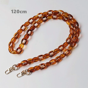 Detail of 120cm amber resin chain strap for handbags with golden metal lobster clasps