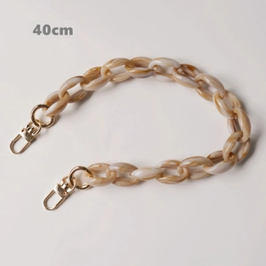Detail of 40cm vintage resin acrylic chain strap with gold lobster clasps for handbags