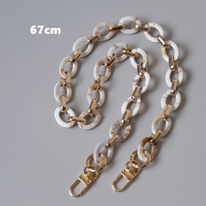 Close-up of a 67cm marble acrylic and gold metal chain strap with lobster clasps