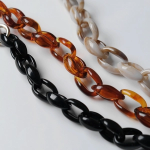 Thick acrylic purse chains in black, tortoiseshell, and marble white for shoulder bags