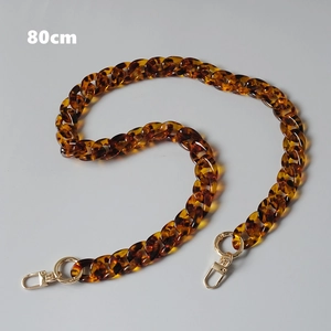 Detailed macro view of 80cm vintage leopard acrylic chain with gold metal clasps