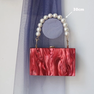 Elegant red marble texture evening clutch bag with 30cm pearl beaded handle and gold clasp