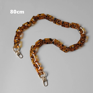 Close-up of 80cm leopard print acrylic bag chain with gold metal lobster clasps