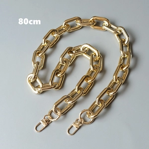 Detail of 80cm chunky gold metal chain strap with polished lobster clasps for handbags