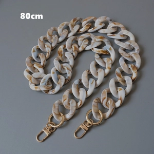 Close-up of 80cm resin chain strap with beige marble texture and gold lobster clasps