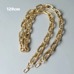Macro view of a 120cm chunky gold metal chain strap with lobster clasps for handbags