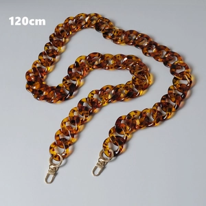 Close-up of a 120cm amber leopard acrylic chain strap with gold lobster clasps