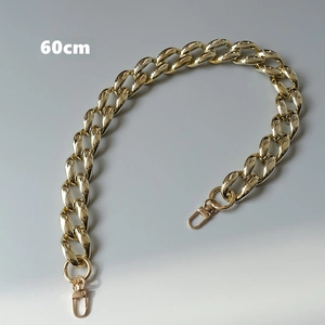 Detailed view of a 60cm shiny gold chunky curb chain strap with metal lobster clasps