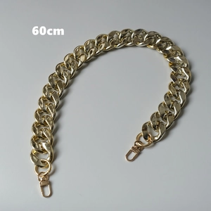 Detailed view of a 60cm thick golden metal chain strap with sturdy lobster clasps