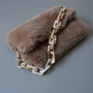 Brown faux fur plush handbag with acrylic marble chain strap and gold hardware