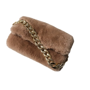 Brown faux fur shoulder bag for women featuring a thick chunky golden metal chain strap