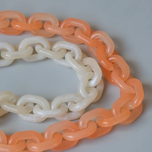 Acrylic candy color crossbody phone chain in creamy white and translucent orange resin