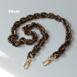 Detail view of 84cm brown resin acrylic chain with tortoise pattern and gold metal clasps
