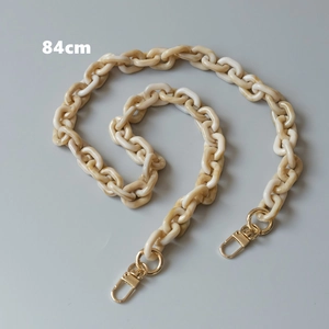 Detailed view of 84cm amber marble resin chain strap with light gold spring buckles