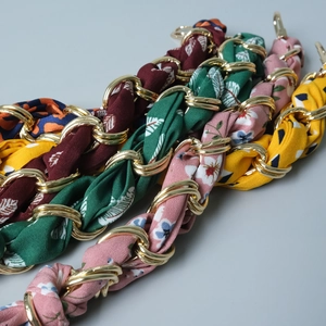 Short handle bag chains featuring woven metal links and colorful silk patterned scarves