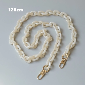 Detailed view of 120cm cream acrylic crossbody chain with golden metal lobster clasps