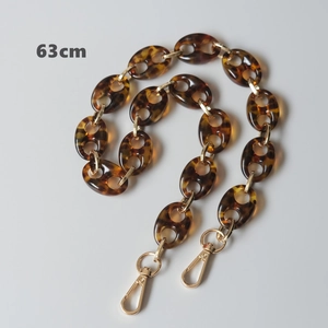 Detailed view of a 63cm leopard print acrylic bag chain with gold metal rings and lobster clasps