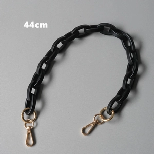 Detailed view of a 44cm matte black acrylic chain strap with gold swivel spring hooks